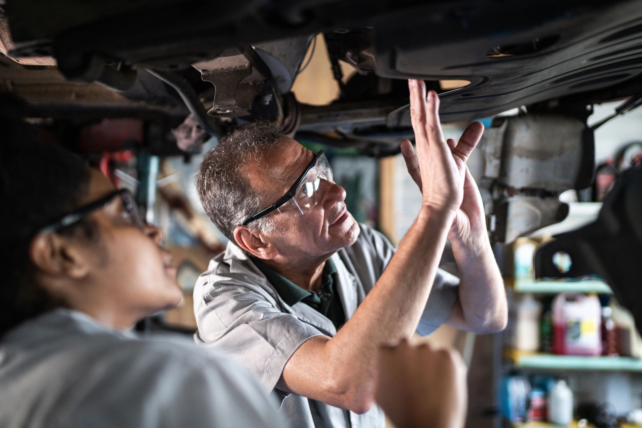Mechanic speaking with customer in repair shop